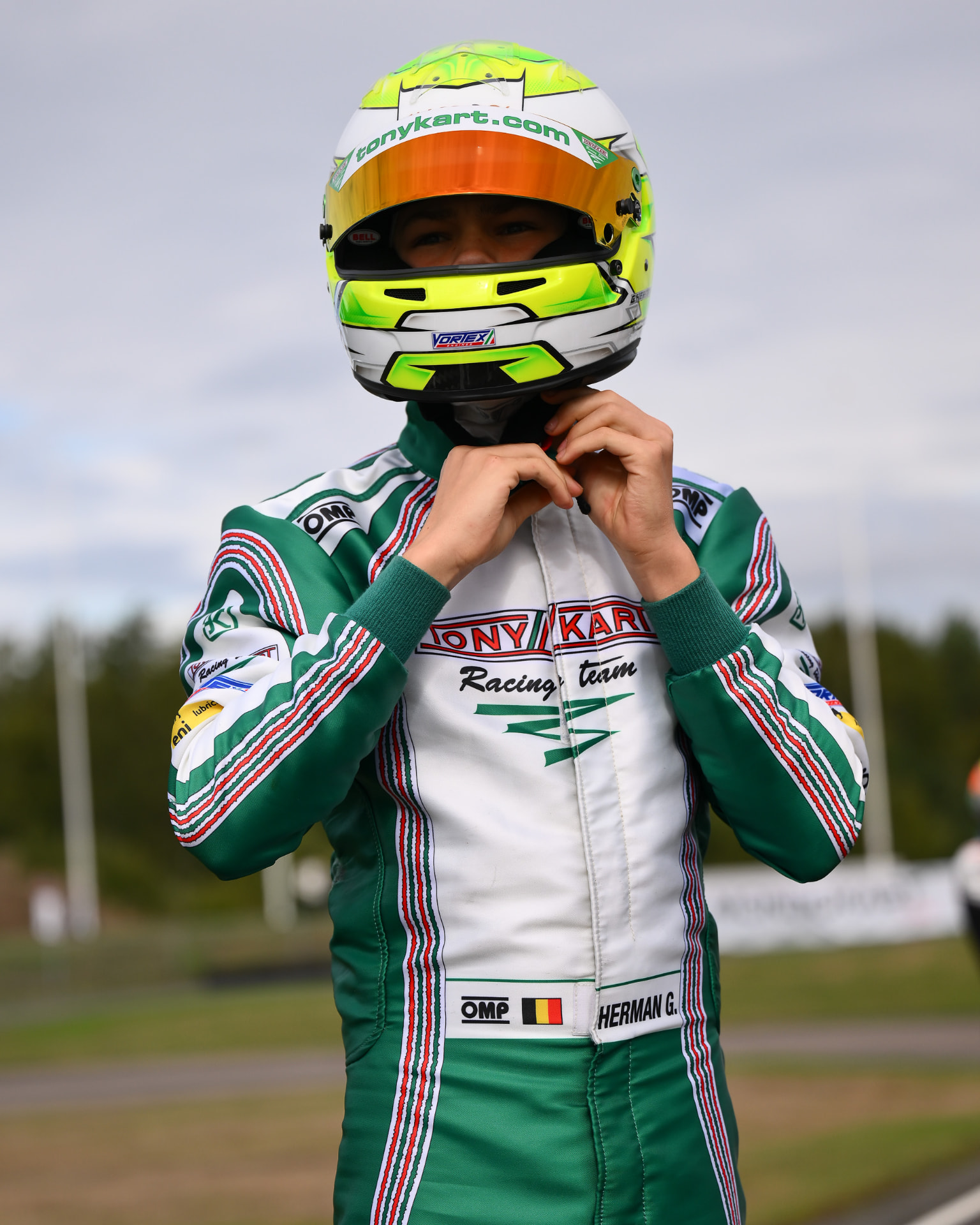 Gilles fastening his helmet in his Tony Kart suit